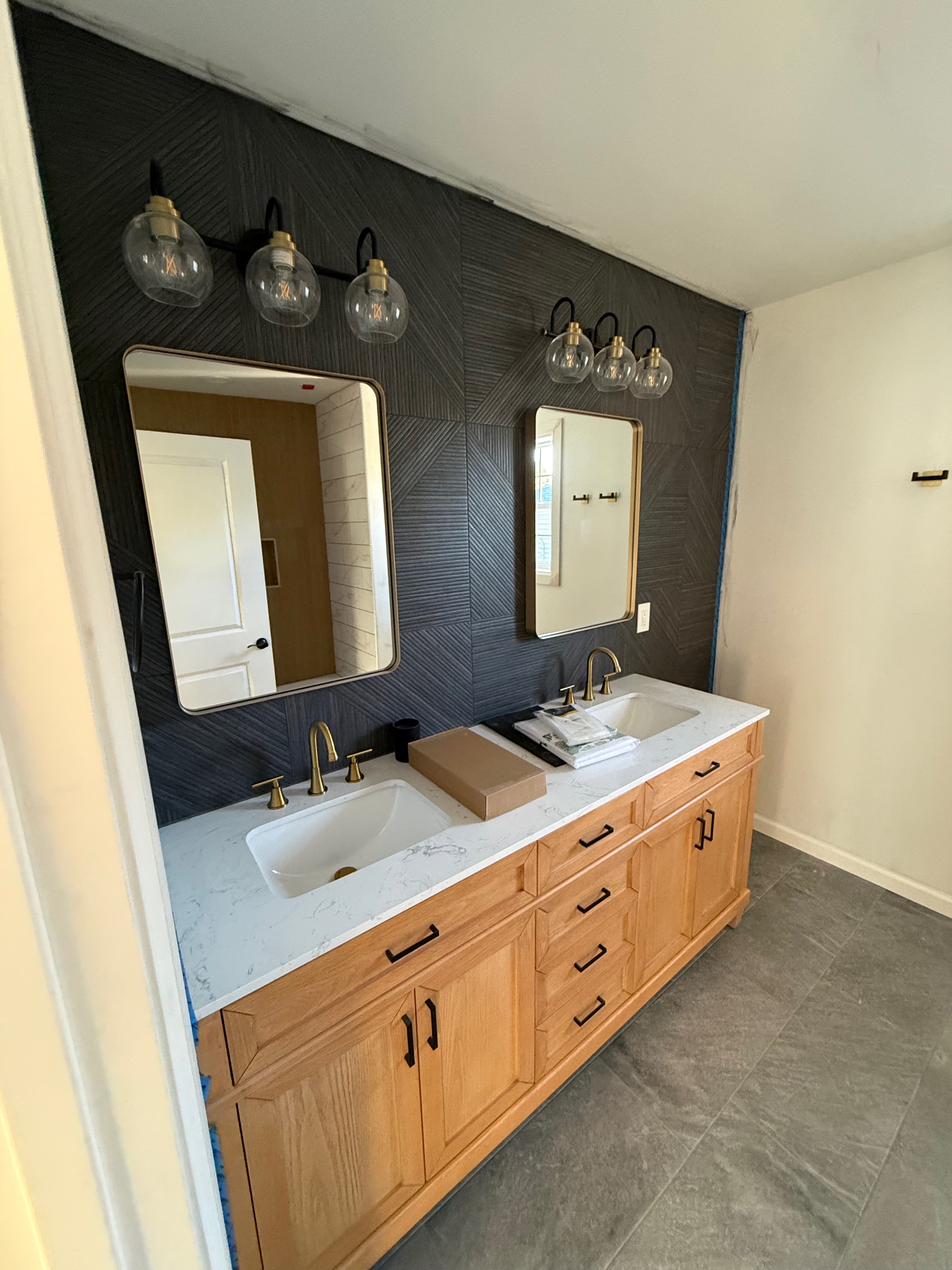 Master bathroom renovation — custom vanity, designer tile, gold fixtures